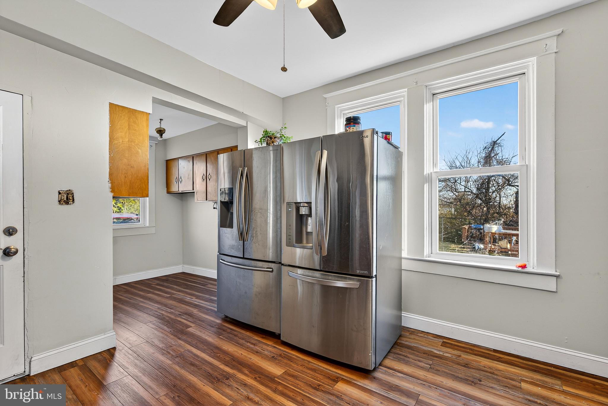511 47th Street Baltimore, MD 21224 - Photo 37 of 44 a metallic refrigerator freezer sitting in a room