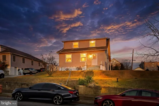 a view of a car parked in front of a house
