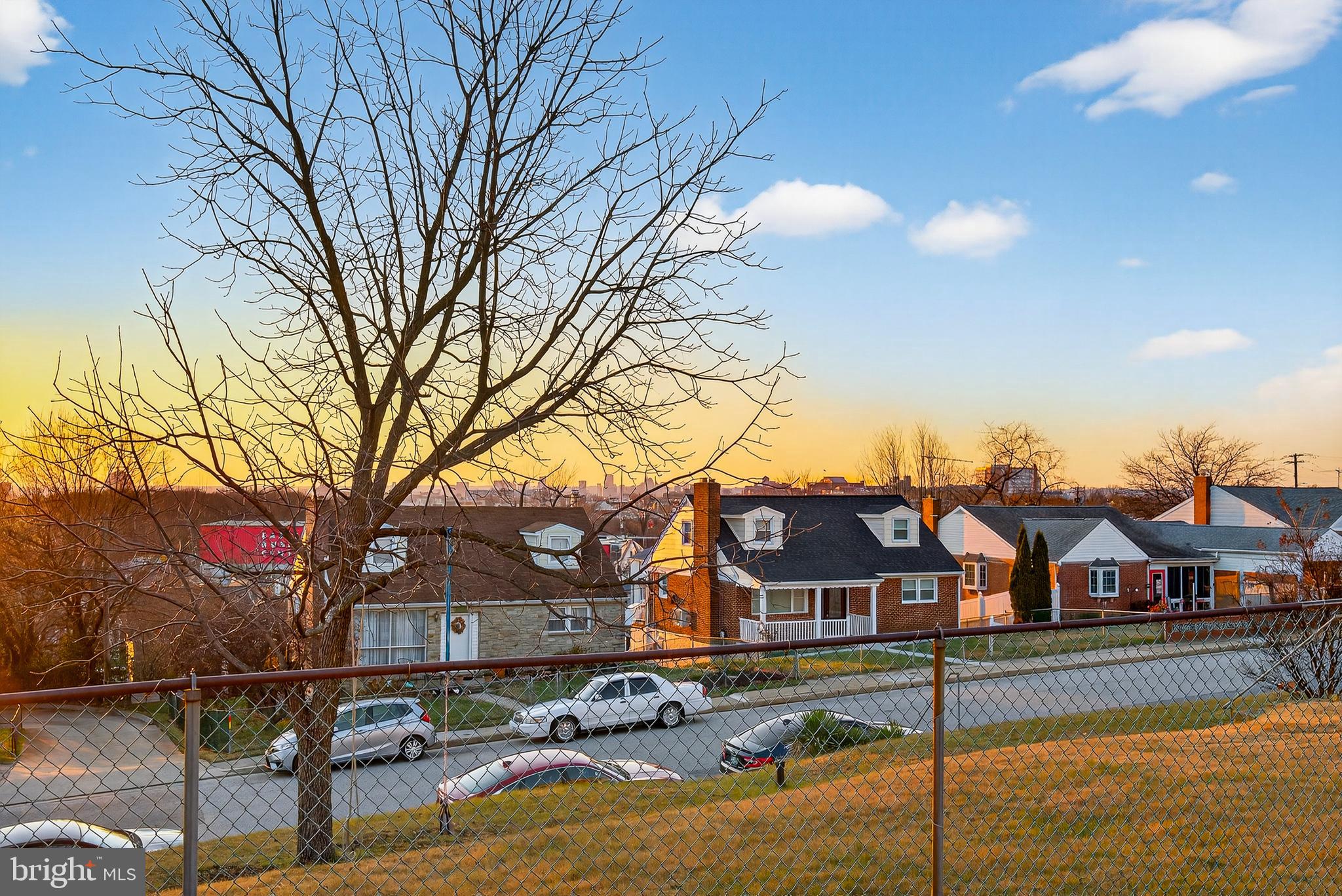 511 47th Street Baltimore, MD 21224 - Photo 8 of 44 a front view of a house with yard and lake view