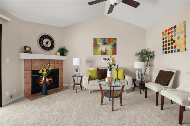a living room with furniture and a fireplace