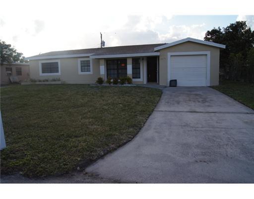 1651 North Cypress Road Pompano Beach, FL 33060 - Photo 1 of 12 a view of house with outdoor space