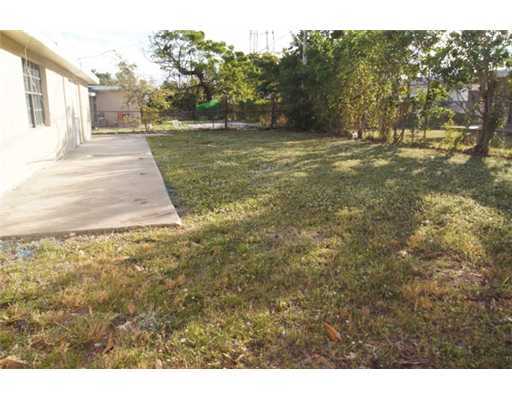 1651 North Cypress Road Pompano Beach, FL 33060 - Photo 11 of 12 a view of a yard with trees