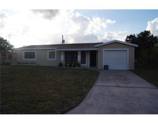 1651 North Cypress Road Pompano Beach, FL 33060 - Photo 12 of 12 a view of house with yard