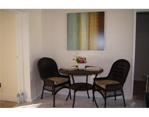 1651 North Cypress Road Pompano Beach, FL 33060 - Photo 4 of 12 a view of a dining room with furniture and wooden floor