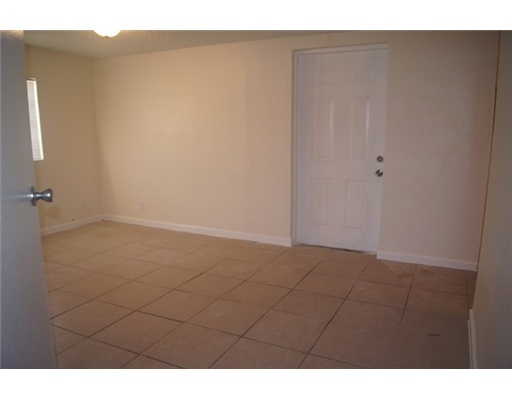 1651 North Cypress Road Pompano Beach, FL 33060 - Photo 8 of 12 a view of an empty room