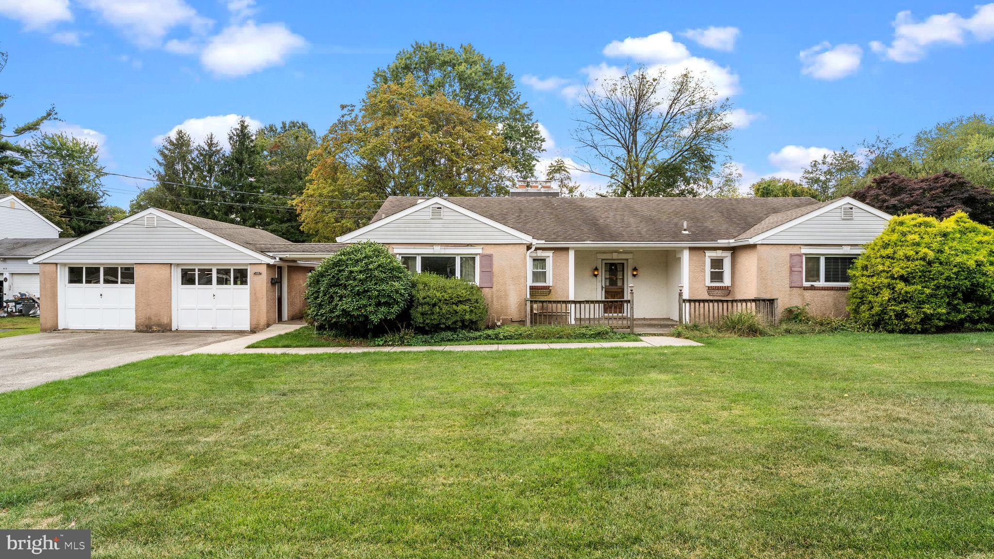 69 Crooked Billet Road Hatboro, PA 19040 - Photo 1 of 33 a front view of a house with a garden