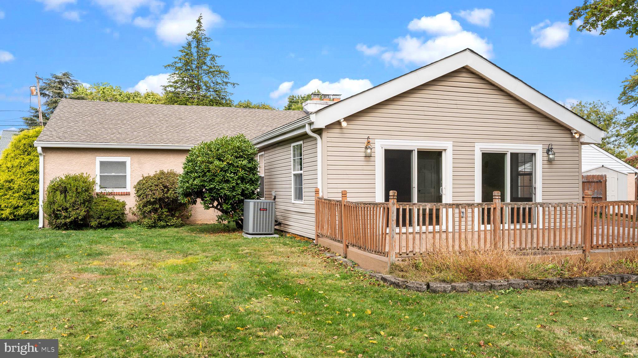 69 Crooked Billet Road Hatboro, PA 19040 - Photo 26 of 33 a view of a house with a yard and flower garden