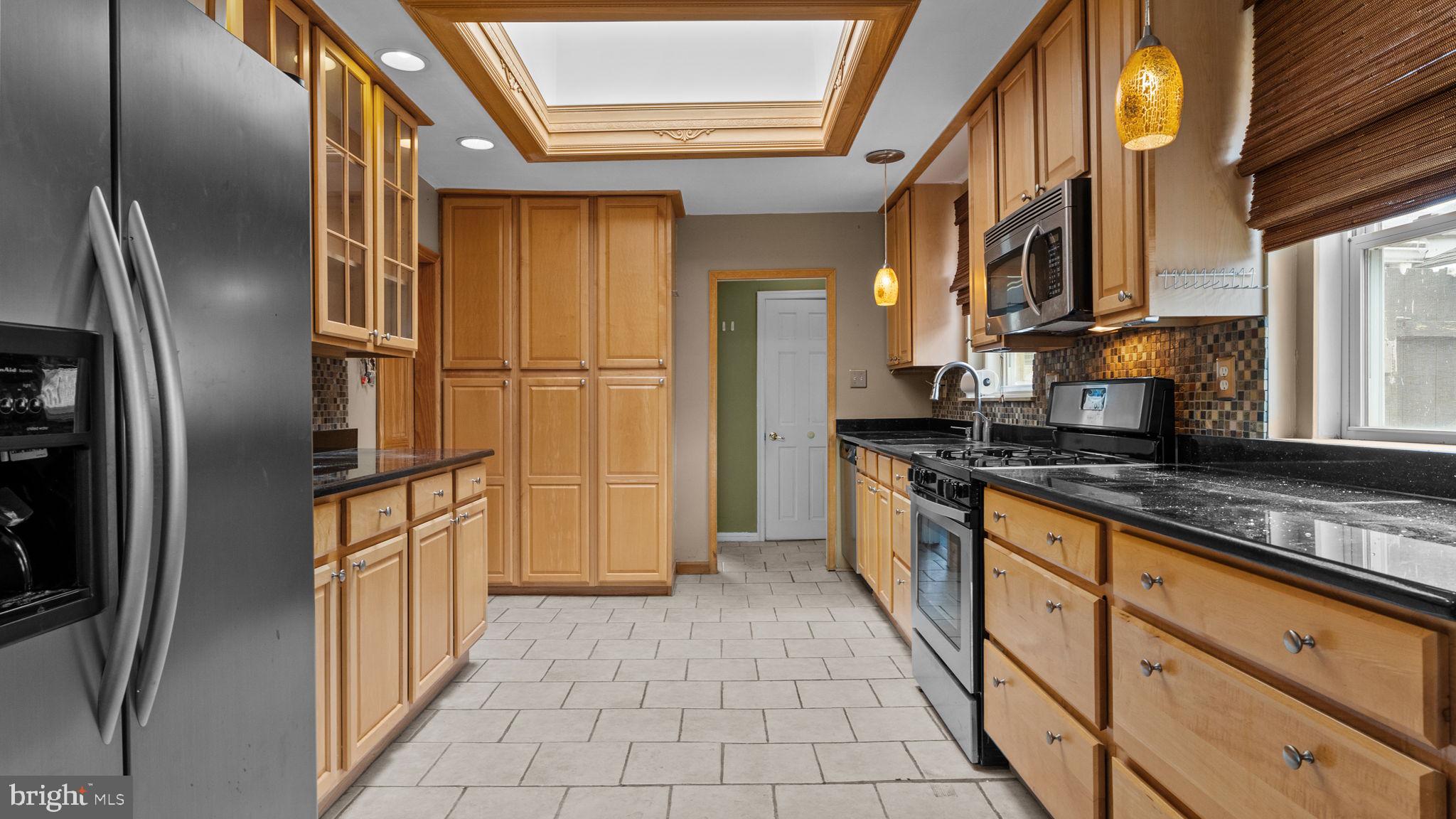 69 Crooked Billet Road Hatboro, PA 19040 - Photo 4 of 33 a kitchen with stainless steel appliances granite countertop a refrigerator and a sink