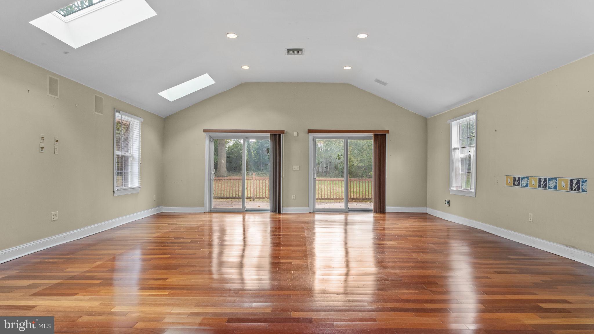 69 Crooked Billet Road Hatboro, PA 19040 - Photo 7 of 33 a view of an empty room with glass door and windows