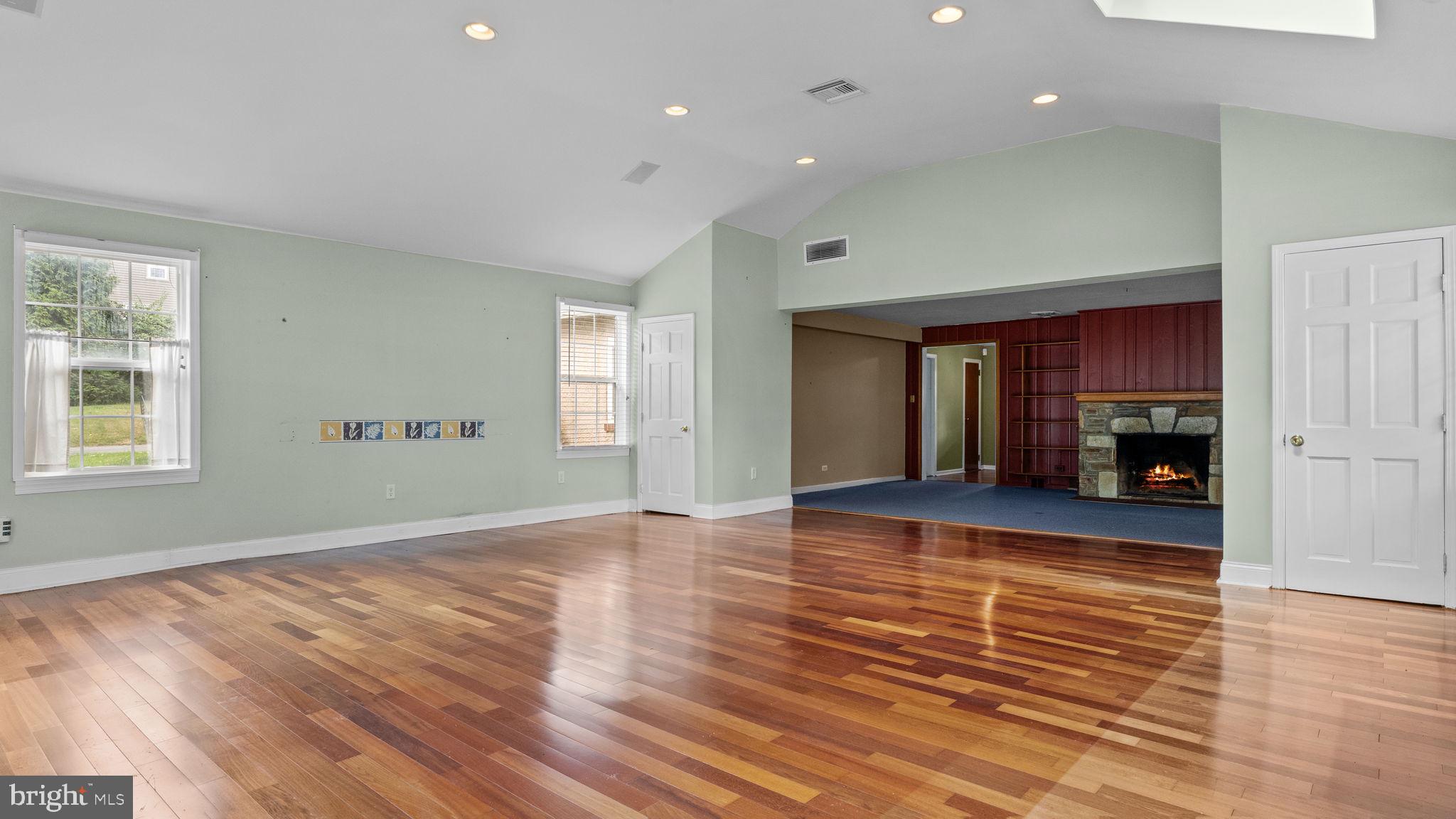 69 Crooked Billet Road Hatboro, PA 19040 - Photo 9 of 33 a view of empty room with wooden floor and kitchen view