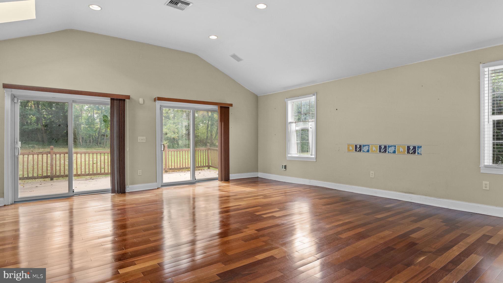 69 Crooked Billet Road Hatboro, PA 19040 - Photo 10 of 33 a view of an empty room with wooden floor and a window