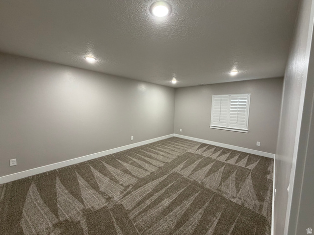 2350 North 1075 West Helper, UT 84526 - Photo 36 of 49 Empty room featuring a textured ceiling, carpet floors, and recessed lighting