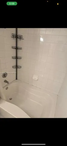 a view of a car is parked in front of a building