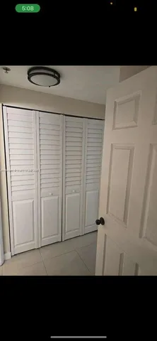 a view of swimming pool with outdoor seating and yard in back