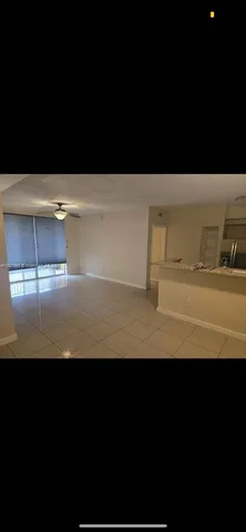 a view of kitchen island with stainless steel appliances