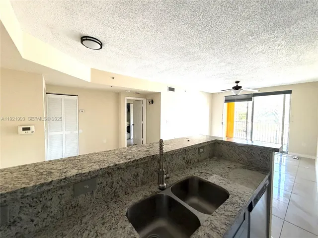 a kitchen with a sink and a window