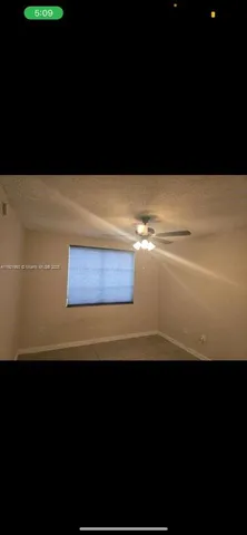 a view of kitchen island with wooden floor