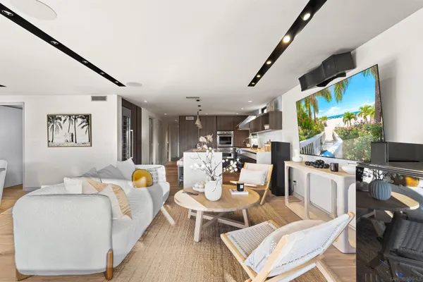 a living room with fireplace furniture and a flat screen tv