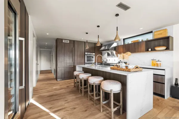 a kitchen with a table and chairs in it