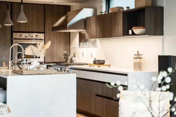 a kitchen with stainless steel appliances granite countertop sink stove and cabinets