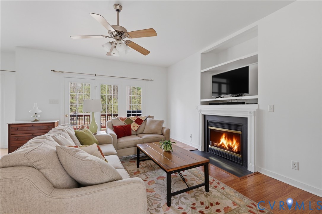 3236 Lakewood Road Glen Allen, VA 23060 - Photo 4 of 45 a living room with furniture a flat screen tv and a fireplace