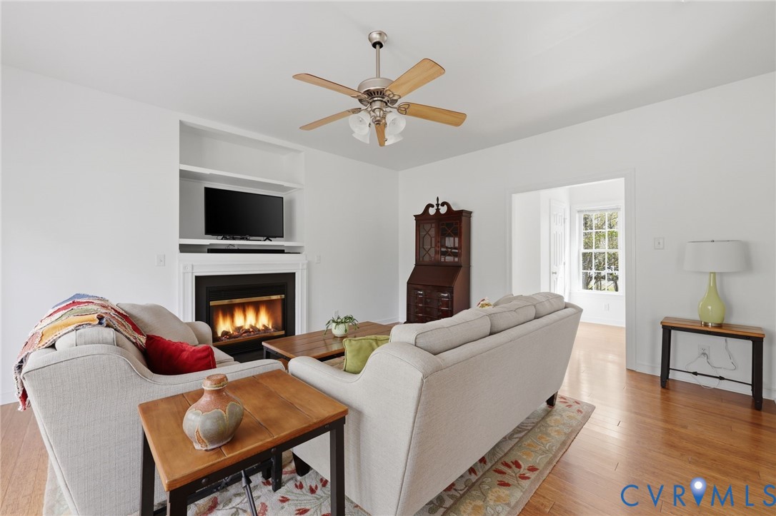 3236 Lakewood Road Glen Allen, VA 23060 - Photo 5 of 45 a living room with furniture a fireplace and a flat screen tv