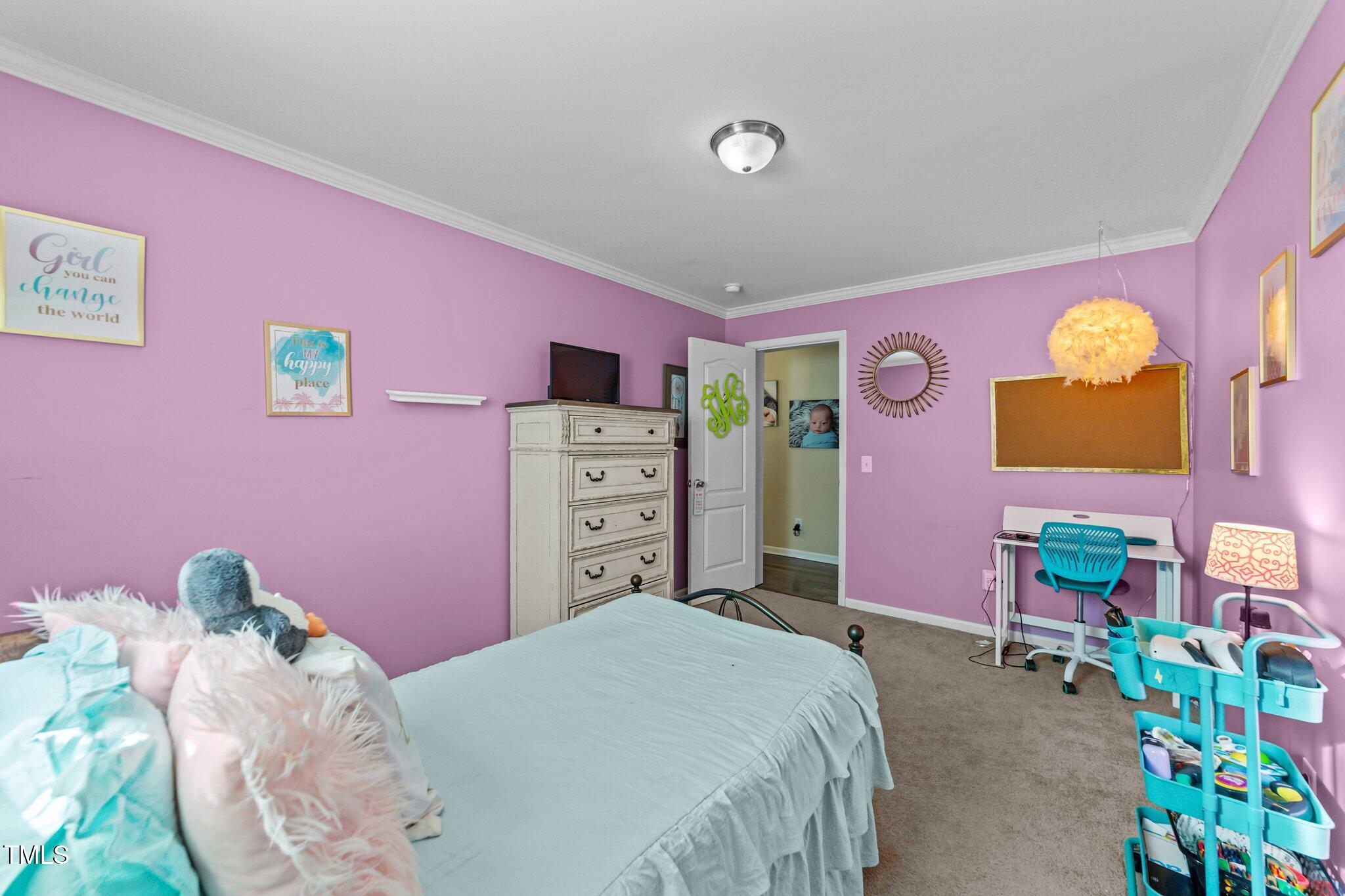 1500 Cheves Road Zebulon, NC 27597 - Photo 24 of 42 a bedroom with a bed and a couch