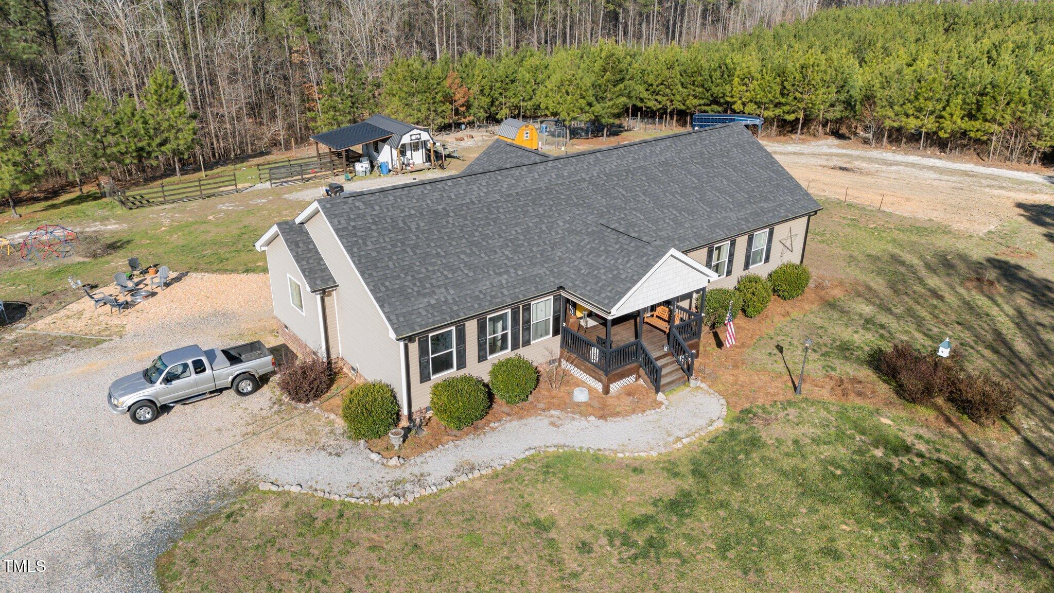 1500 Cheves Road Zebulon, NC 27597 - Photo 36 of 42 an aerial view of a house with yard basket ball court and outdoor seating