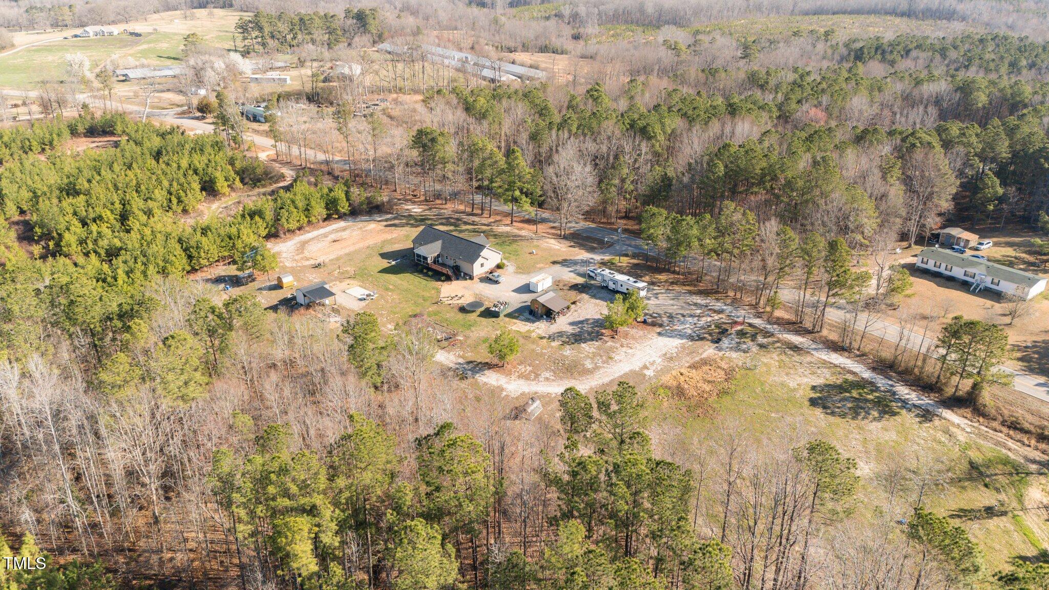 1500 Cheves Road Zebulon, NC 27597 - Photo 41 of 42 a backyard of a house with lots of green space