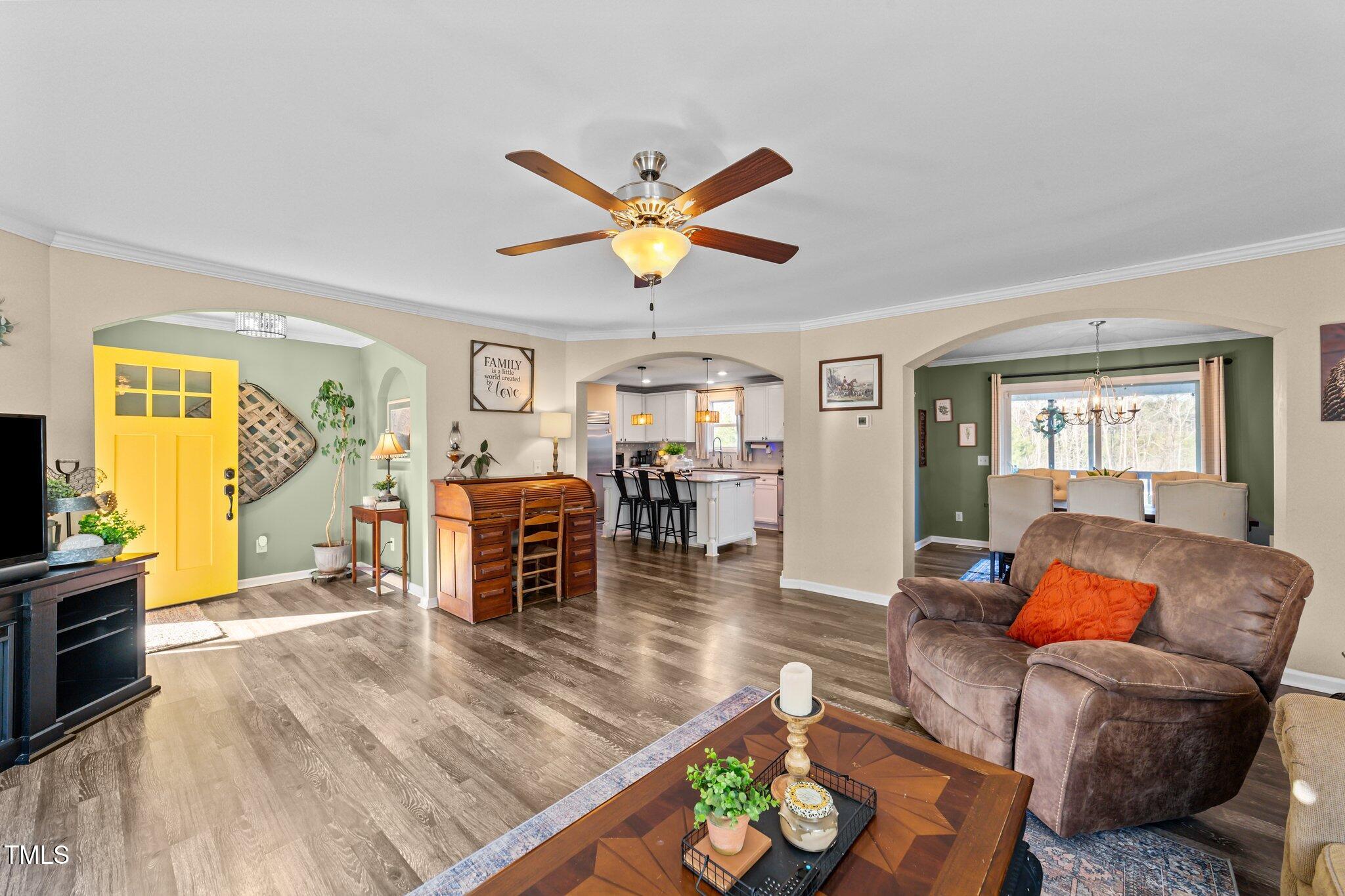 1500 Cheves Road Zebulon, NC 27597 - Photo 7 of 42 a living room with furniture and wooden floor