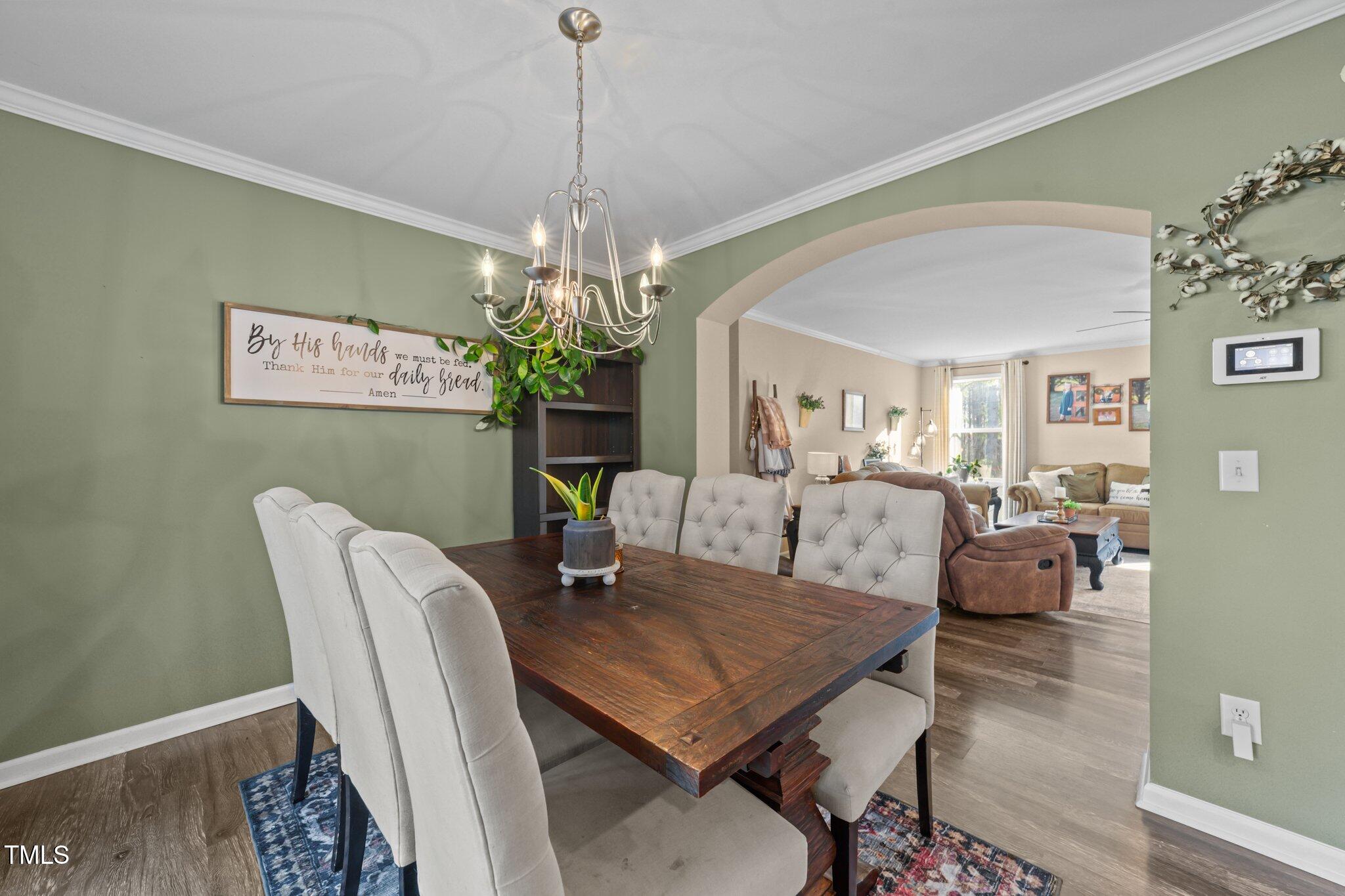 1500 Cheves Road Zebulon, NC 27597 - Photo 9 of 42 a view of a dining room with furniture and chandelier