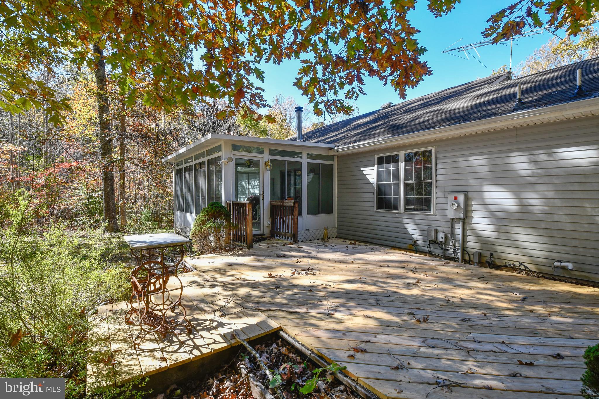 5911 Block House Road Partlow, VA 22534 - Photo 10 of 42 Newly resurfaced deck off glass sunroom addition