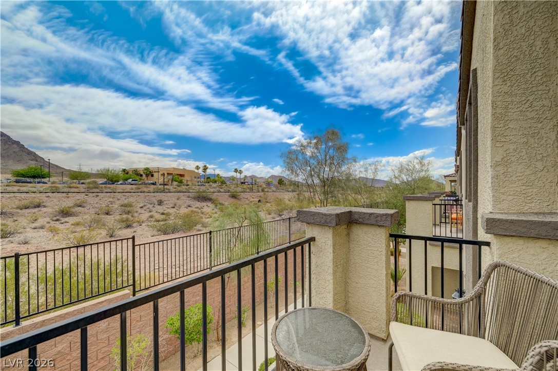 1287 Raritan Place Henderson, NV 89002 - Photo 19 of 21 Enjoy expansive desert views from a private balcony, offering a tranquil outdoor retreat.