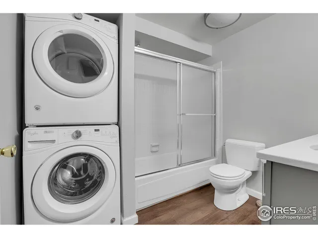 a bathroom with a toilet and a washing machine