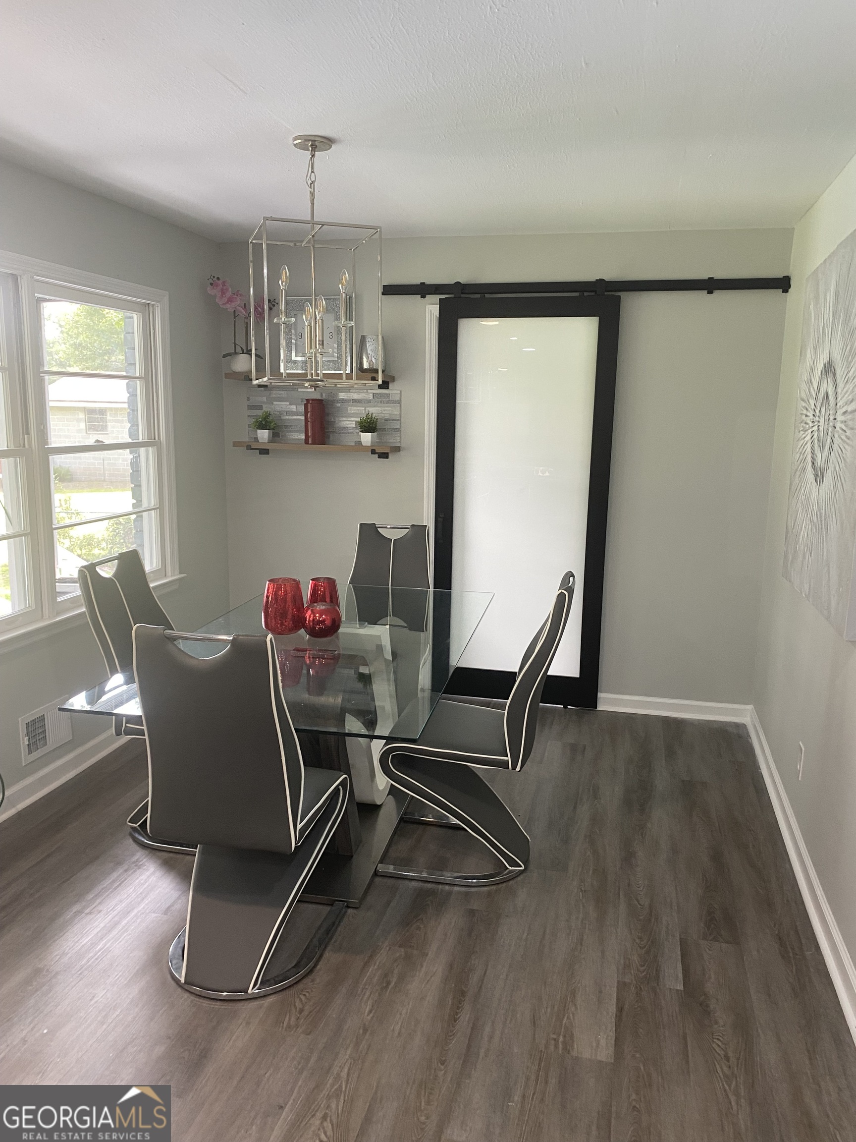 7383 Pleasant Hill Road Lithonia, GA 30058 - Photo 7 of 18 a view of a dining room with furniture window and wooden floor