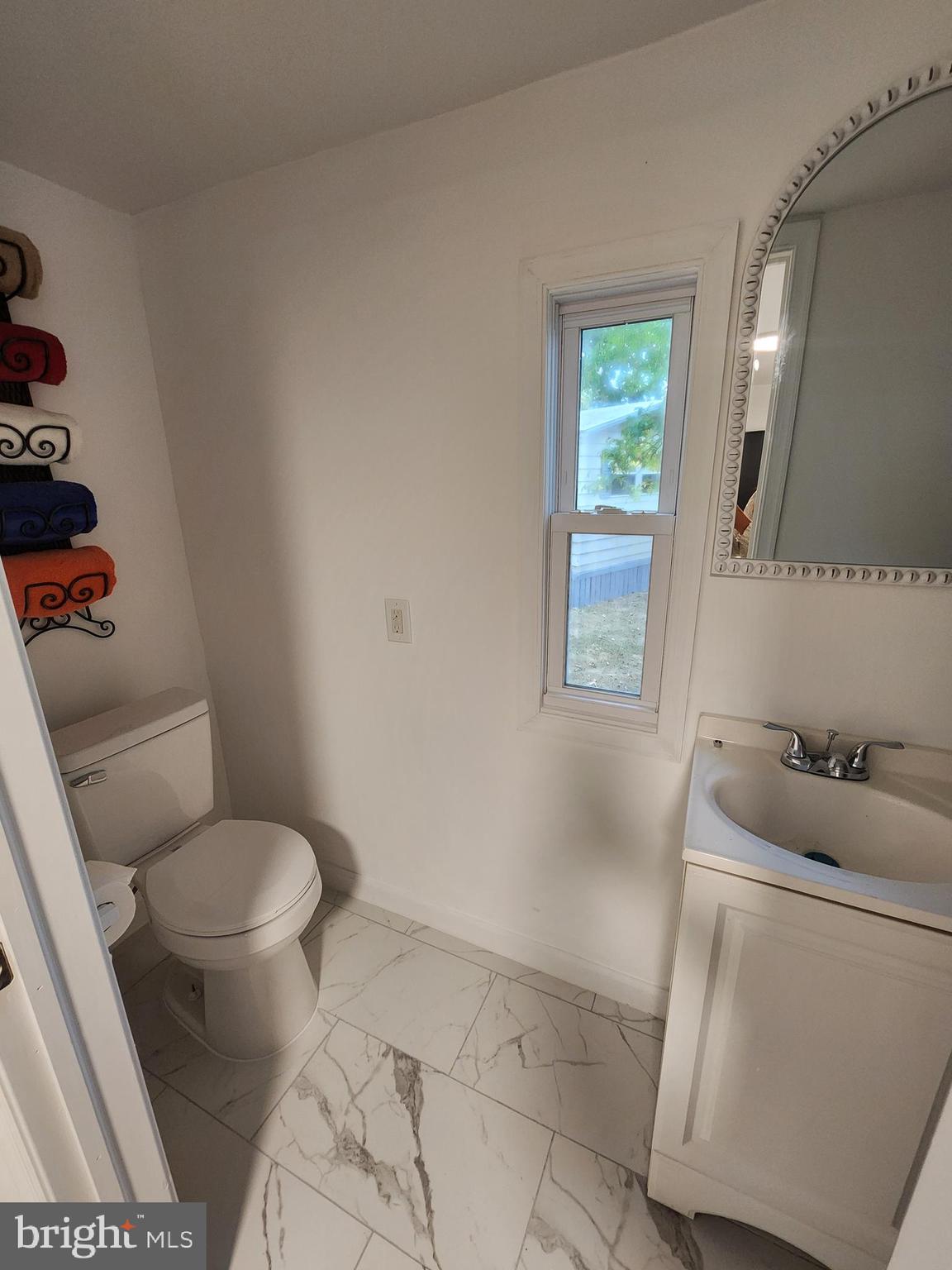 126 Country Lane Buena, NJ 08310 - Photo 7 of 12 a bathroom with a toilet and a sink