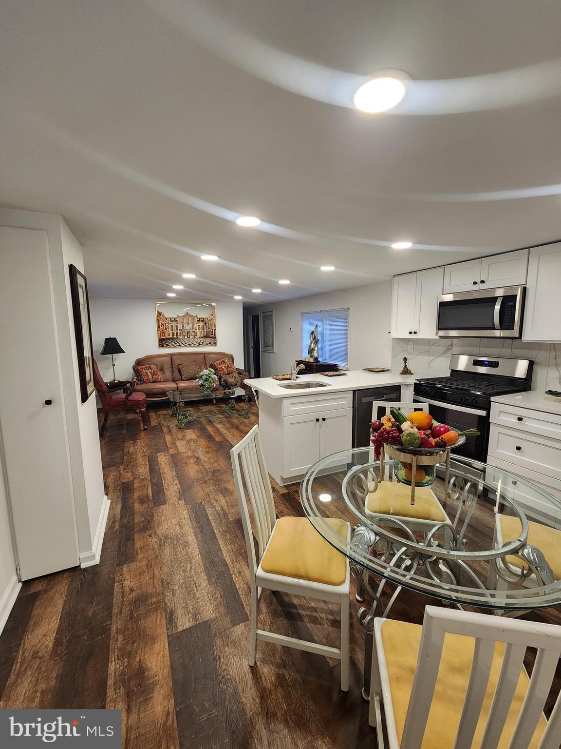 126 Country Lane Buena, NJ 08310 - Photo 8 of 12 a living room with lots of furniture and a view of kitchen
