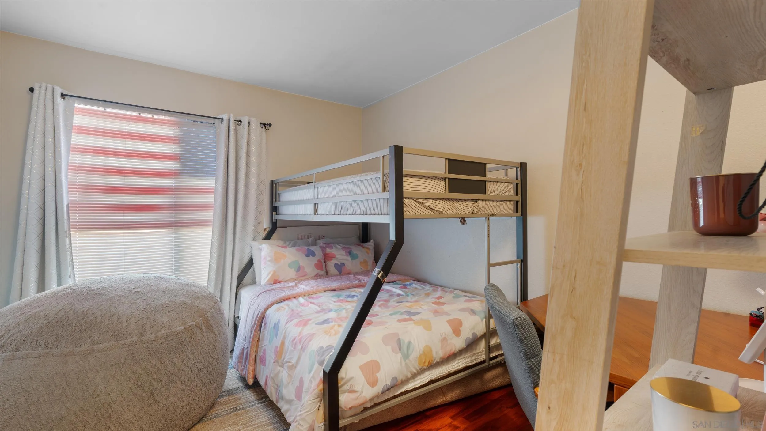 12710 Laurel Street, Unit 113 Lakeside, CA 92040 - Photo 10 of 20 a bedroom with a bed and wooden floor