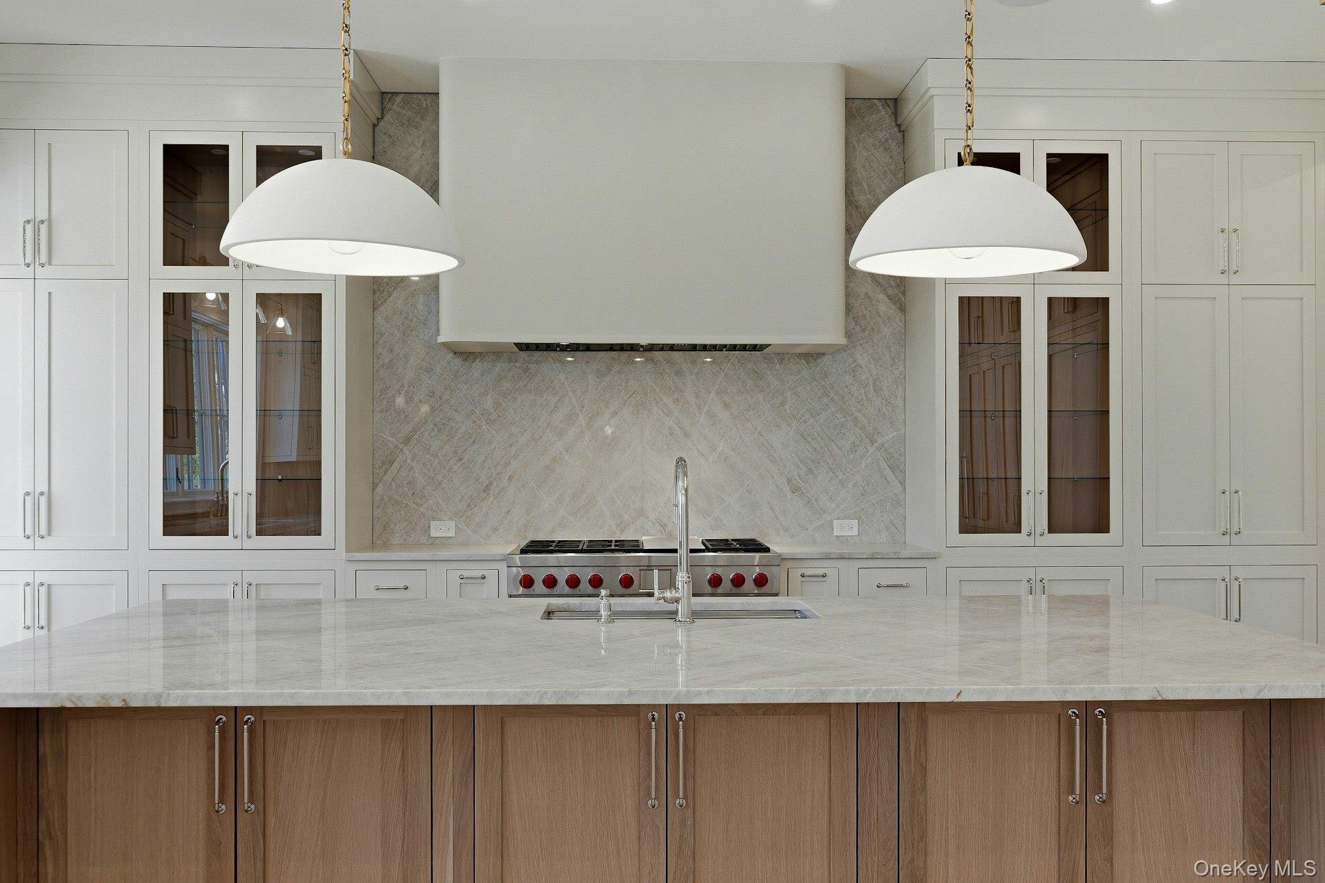 25 West Creek Farms Road Sands Point, NY 11050 - Photo 11 of 39 a view of a kitchen with furniture and chandelier