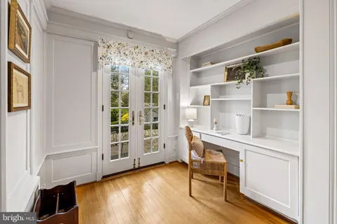 a workspace with furniture and window