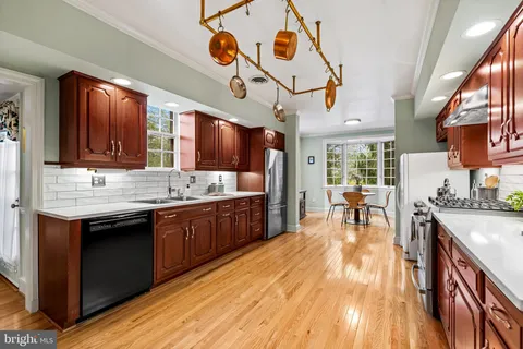 a kitchen with a sink and wooden cabinets