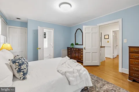 a bedroom with a bed and a television