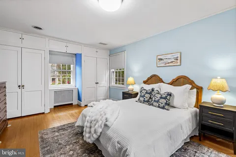 a bedroom with bed and window