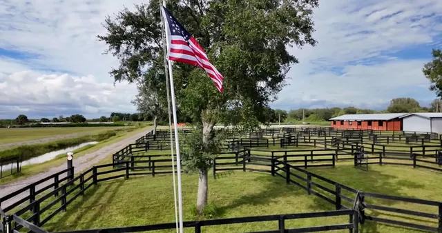 a view of swimming pool with a bench and lake view
