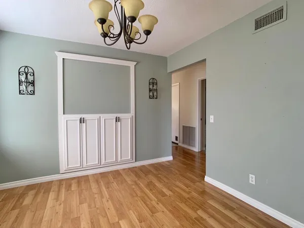 a view of an entryway with wooden floor