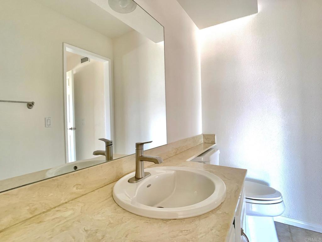 3331 Eton Greens Court Spring Valley, CA 91978 - Photo 20 of 39 a bathroom with a sink and a toilet