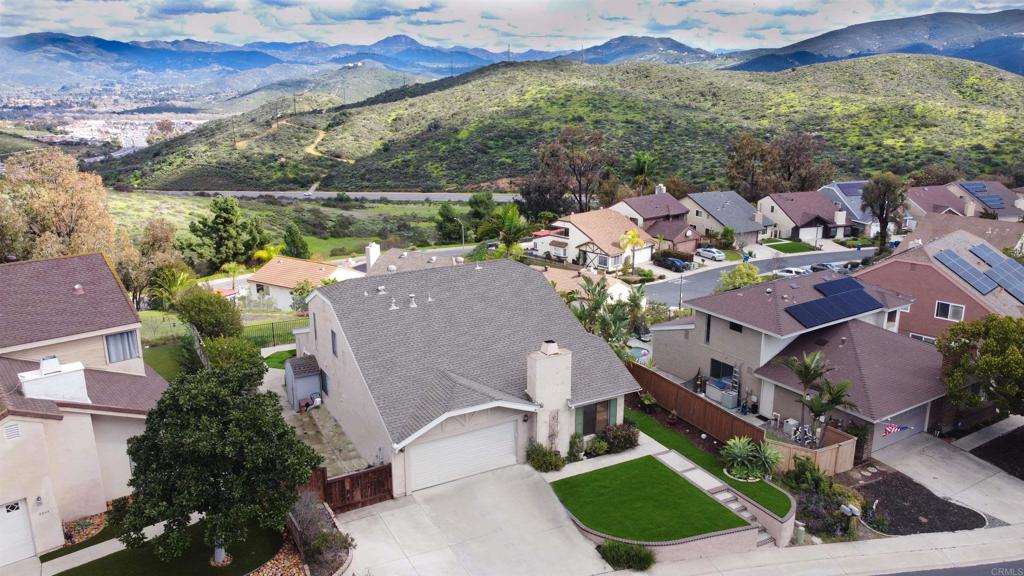 3331 Eton Greens Court Spring Valley, CA 91978 - Photo 2 of 39 an aerial view of a house with a yard and lake view
