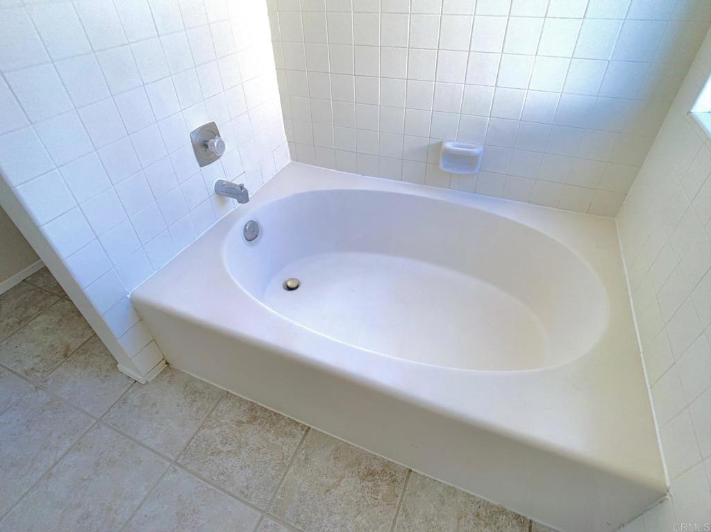 3331 Eton Greens Court Spring Valley, CA 91978 - Photo 21 of 39 a bathroom with a bathtub