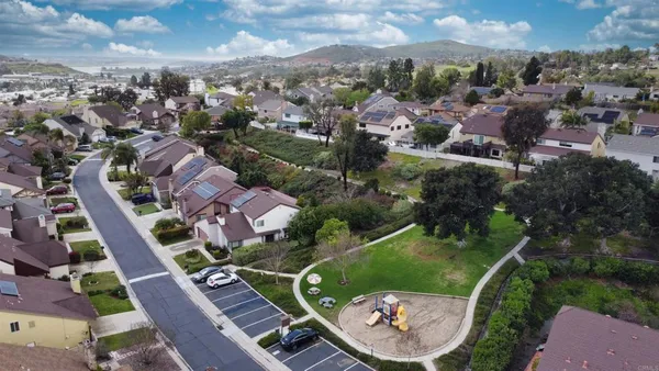 a childrens park with lots of swings and slides
