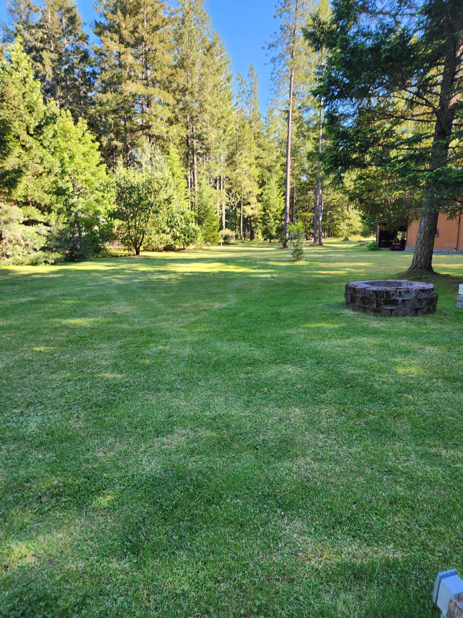 244 Riessen Road Grants Pass, OR 97526 - Photo 37 of 52 a view of a park with large trees